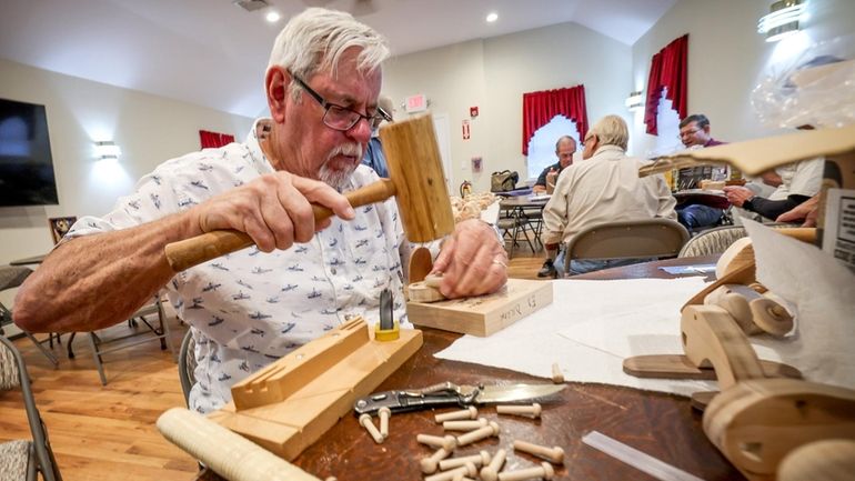 Brian Roughley and fellow members of the Long Island Woodworkers create wooden toys...