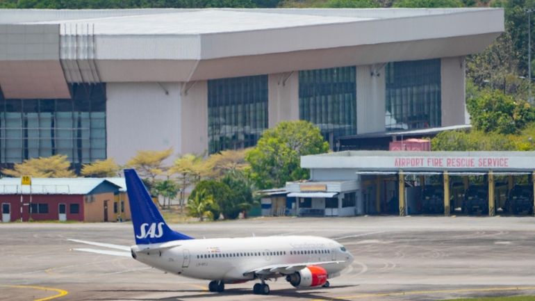 A Scandinavian Airlines medevac plane arrives at Langkawi, where the...