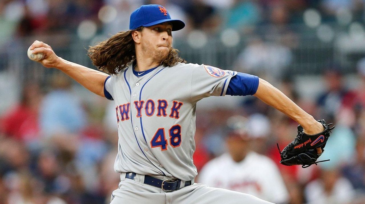 Bats bail out deGrom in Opening Day win for Rangers