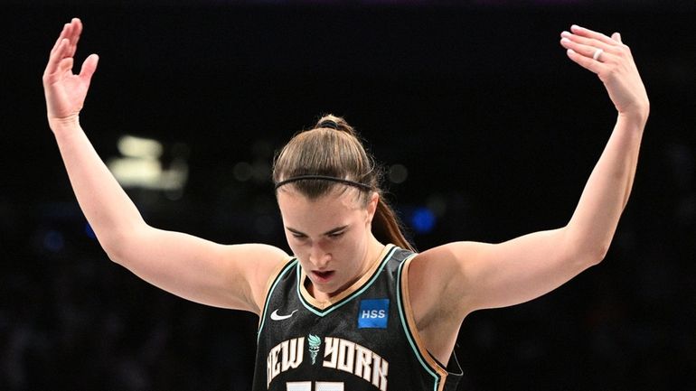 Liberty guard Sabrina Ionescu reacts to the crowd during the...