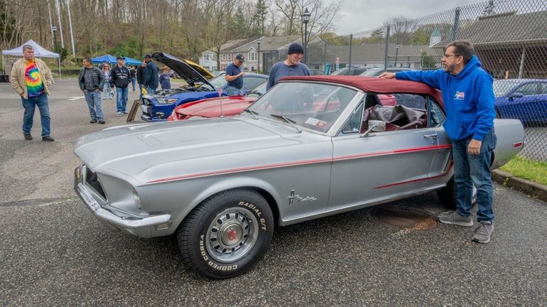 John Desio, 63, of Coram, shows off his 1968 Mustang...