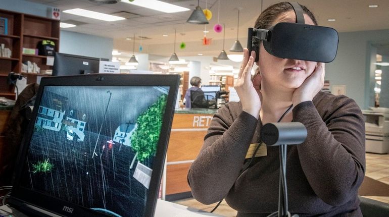 Grace Palmisano experiences a Category 3 hurricane throughvirtual reality goggles...