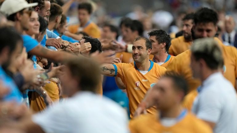 Uruguay's players greets supporters after the Rugby World Cup Pool...