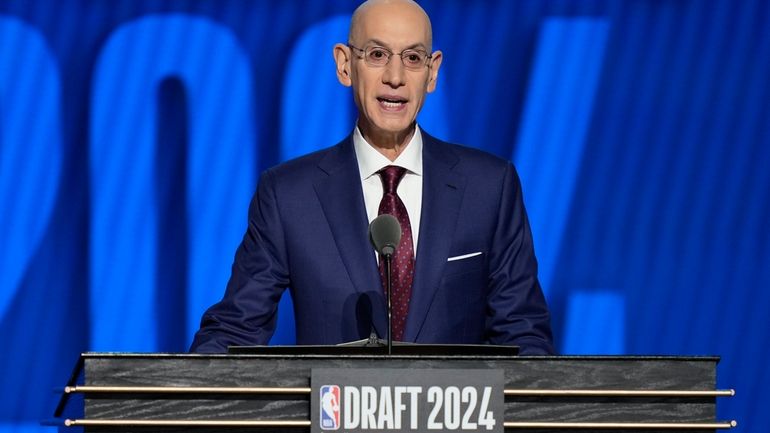 NBA commissioner Adam Silver opens the NBA basketball draft, Wednesday,...