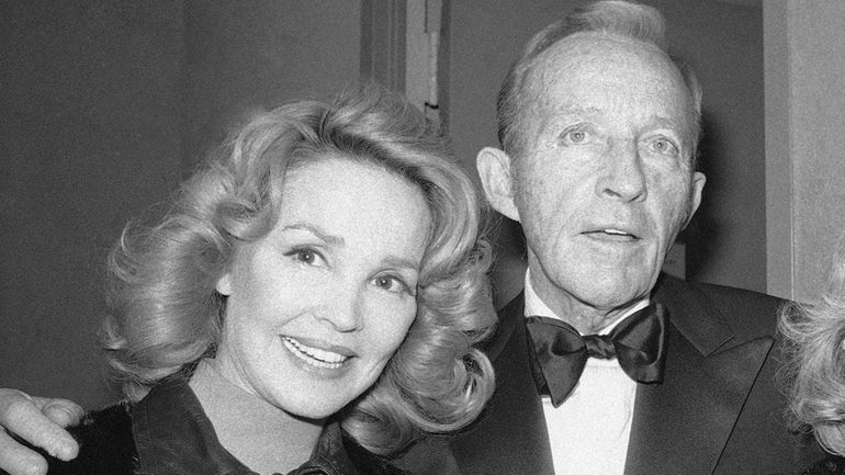 Bing Crosby stands with his wife, Kathryn, left in New...