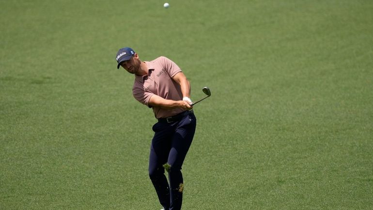 Wyndham Clark hits from the fairway on the second hole...