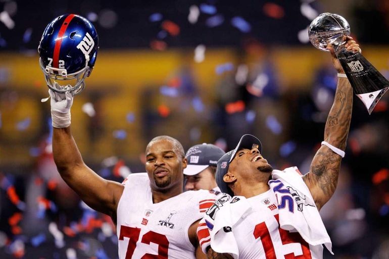 New York Giants - Super Bowl Football New York Giants Victor Cruz (80), and  Hakeem Nicks hoist up the Vince Lombardi Trophy after winning the NFL Super  Bowl XLVI football game against