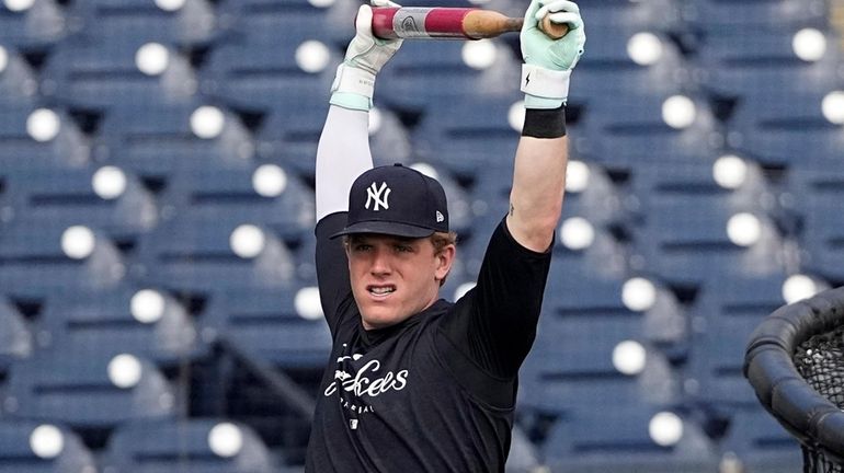 New York Yankees' Harrison Bader stretches before batting practice in...