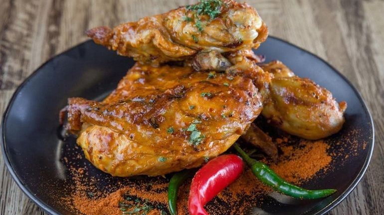 Peri-peri chicken, the signature offering at Peri-Peri Guys, a new...