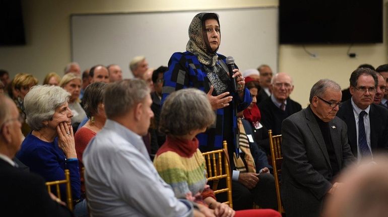 Isma Chaudhry, standing, president of the Islamic Center of Long...