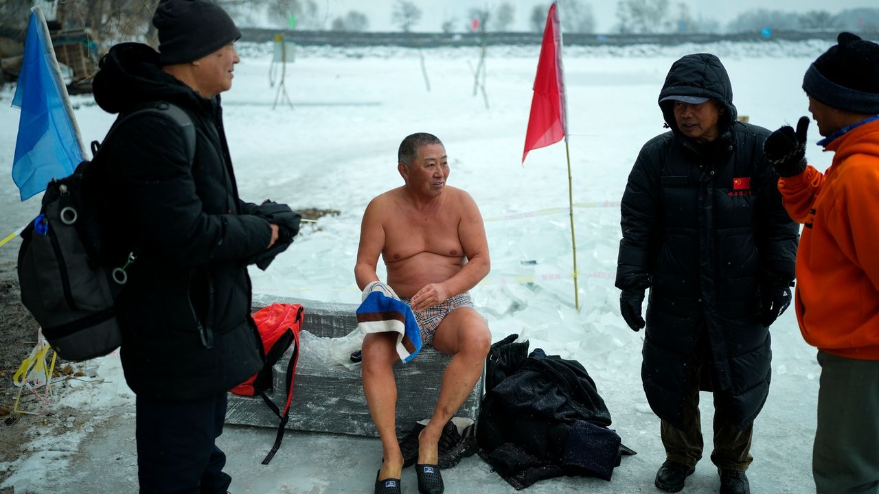 In freezing temperatures, swimmers in China plunge into a river for health and joy