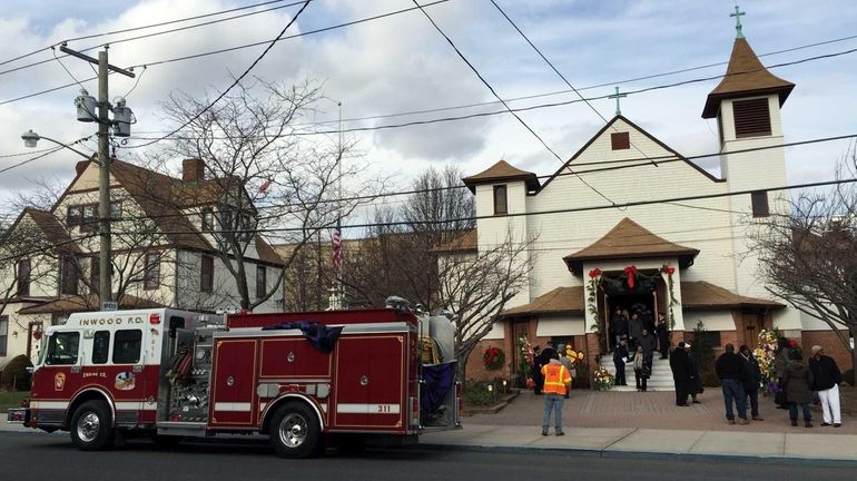 The wake for Inwood volunteer firefighter Joseph Sanford Jr. at...