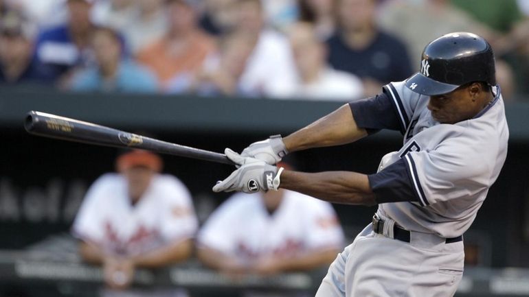 New York Yankees' Curtis Granderson swings on an RBI-triple against...