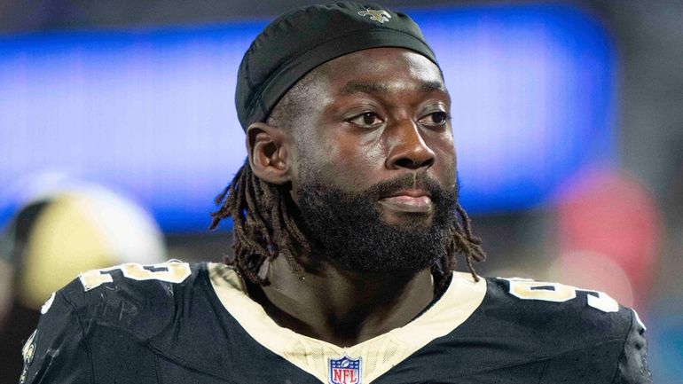 New Orleans Saints defensive end Tanoh Kpassagnon (92) walks the...