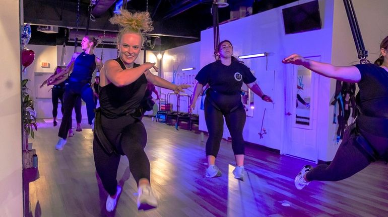 Hannah LaRocco puts bounce into her workout at GoBungee Fitness in...