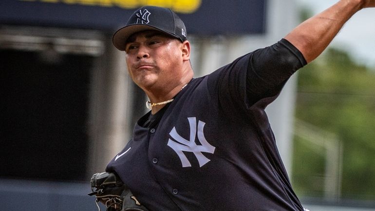 Yankees pitcher Manny Banuelos throws during spring training at George M Steinbrenner...