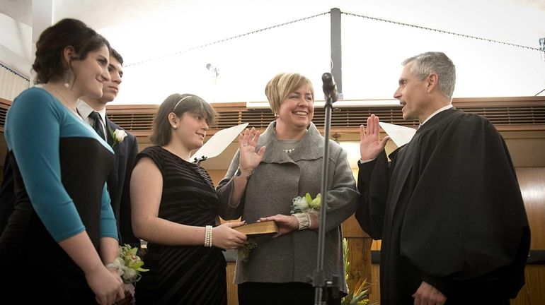 Town of Hempstead Supervisor Kate Murray, with her family by...