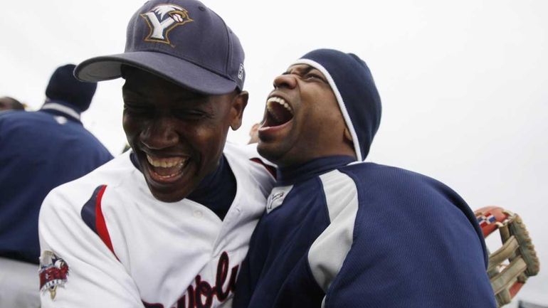 York Revolution outfielders Jose Herrera and Chris Walker celebrate midfield...