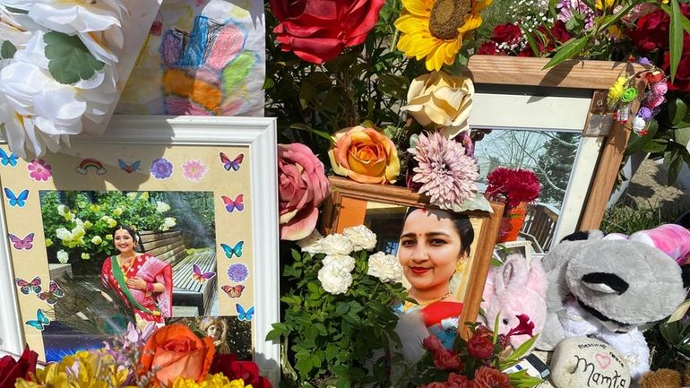 Flowers, candles and photos were placed near Mamta Kafle Bhatt's...