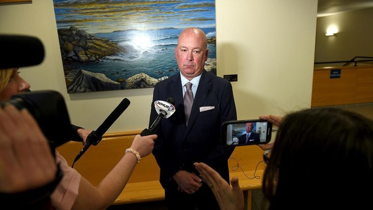 Plaintiff's attorney Rus Rilee speaks to media after a $38...