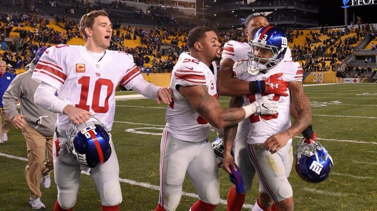 New York Giants wide receiver Odell Beckham Jr. is restrained...