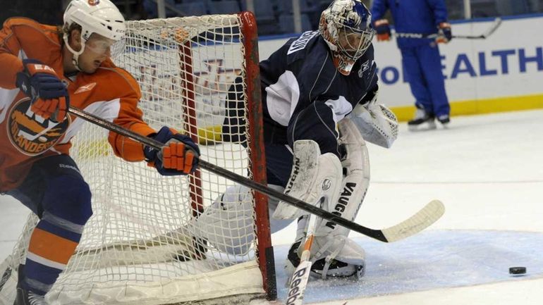 Brian Rolston and goalie Evgeni Nabokov in action on Islanders...