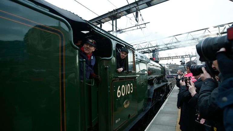 The Flying Scotsman, a historical locomotive, arrives at Kings Cross...