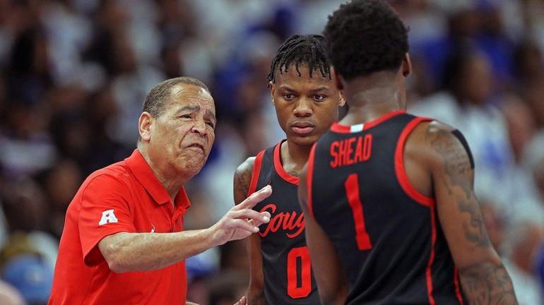 Houston head coach Kelvin Sampson instructs Marcus Sasser and Jamal...