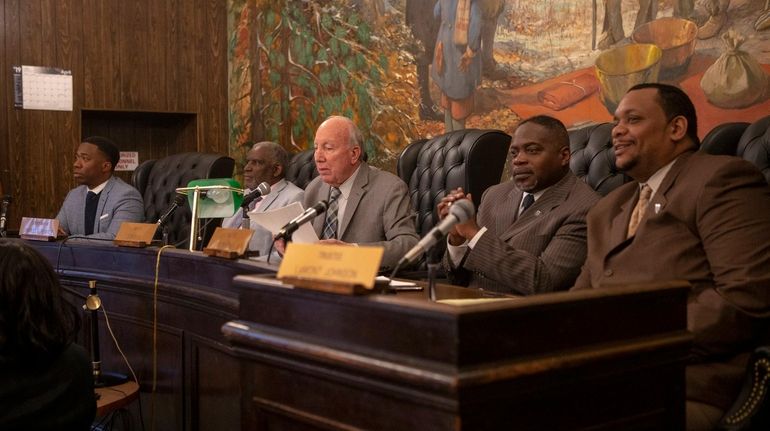 The Hempstead Village Board members: Trustee Jeffery Daniels, left, Deputy Mayor Charles...