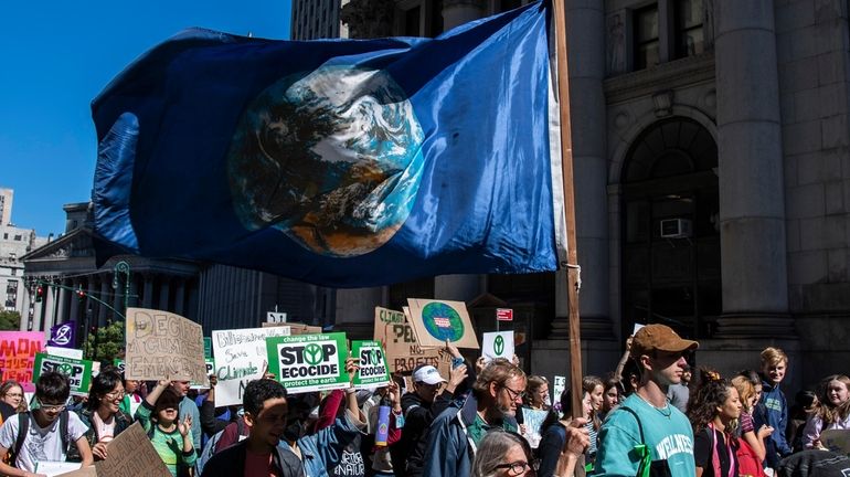 Activists gather and walk through lower Manhattan for the Global...