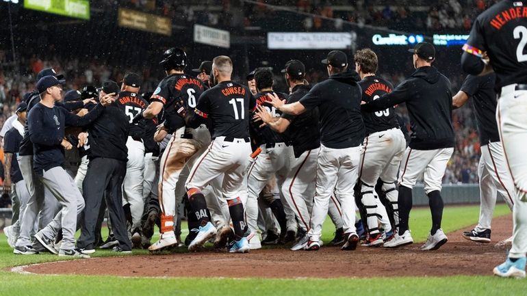 Players clear the benches after the Orioles' Heston Kjerstad was...