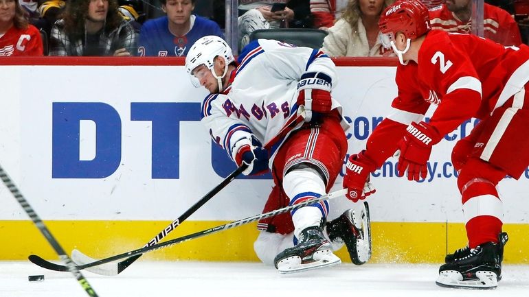 Detroit Red Wings defenseman Olli Maatta (2) tries to stop...