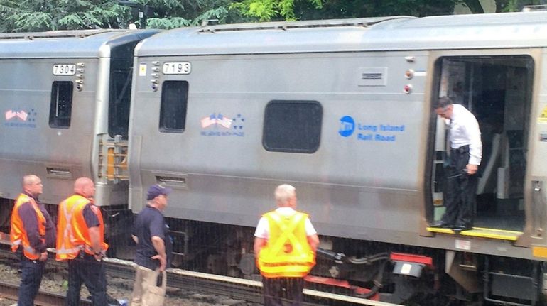 Officials respond to a fatal crash near the LIRR Kew...