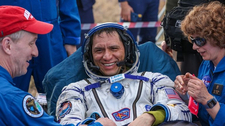 In this photo released by Roscosmos State Corporation, NASA astronaut...