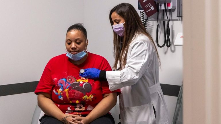 Nurse practitioner Payal Patel treats patient Ni-Ima Lattimer at Harmony...