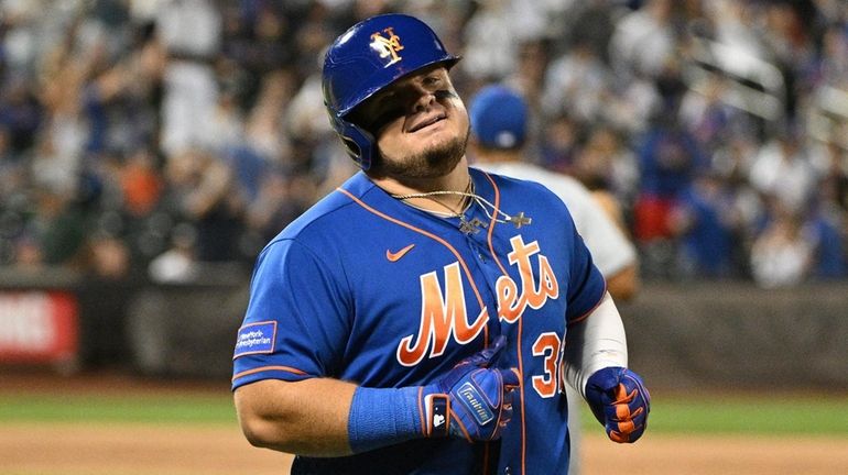 Mets designated hitter Daniel Vogelbach reacts after he grounded into...