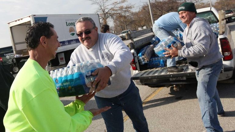 (L-R) Town of Hempstead employees Rob Rugolo, Sal Lostrappo, and...