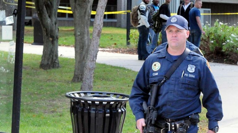 A Suffolk County police emergency service officer walks on the...