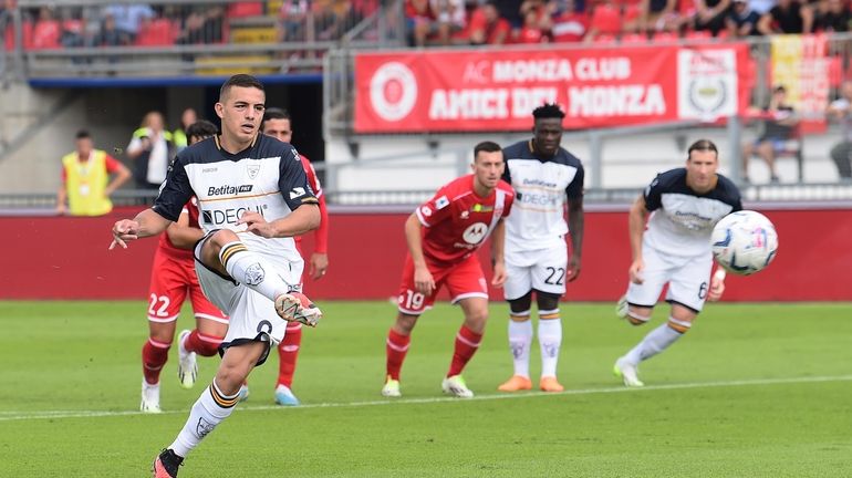 Lecce's Nikola Krstovic scores their side's first goal of the...