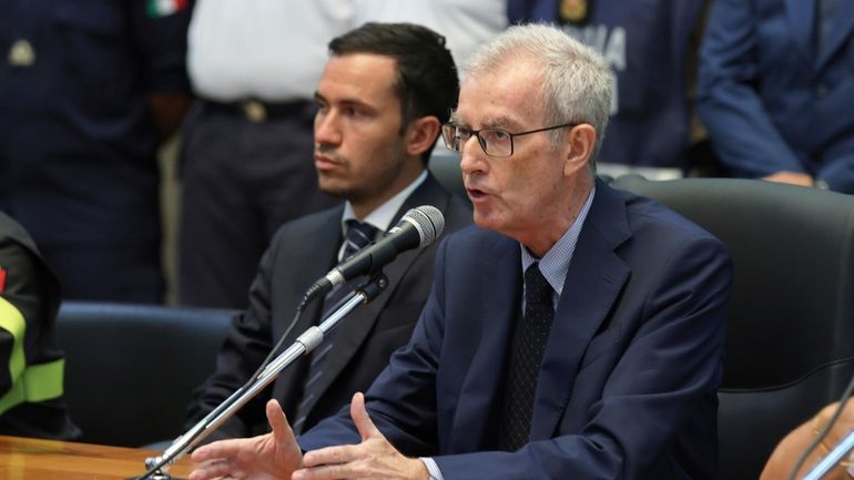 Italian Prosecutor Ambrogio Cartosio, right, attends a press conference on...