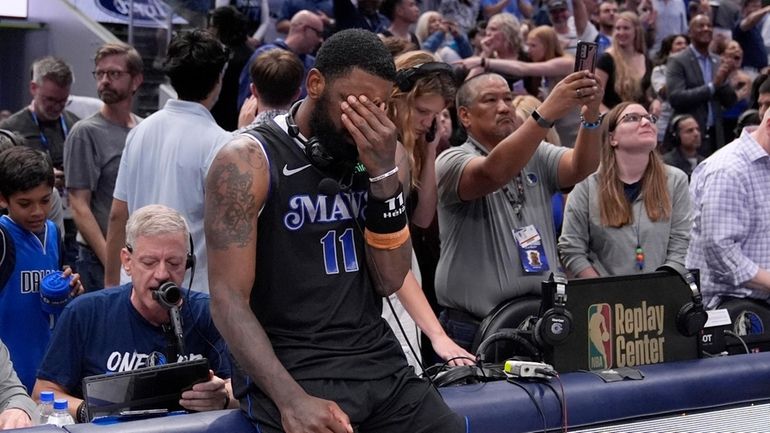 Dallas Mavericks' Kyrie Irving (11) pauses as he waits to...