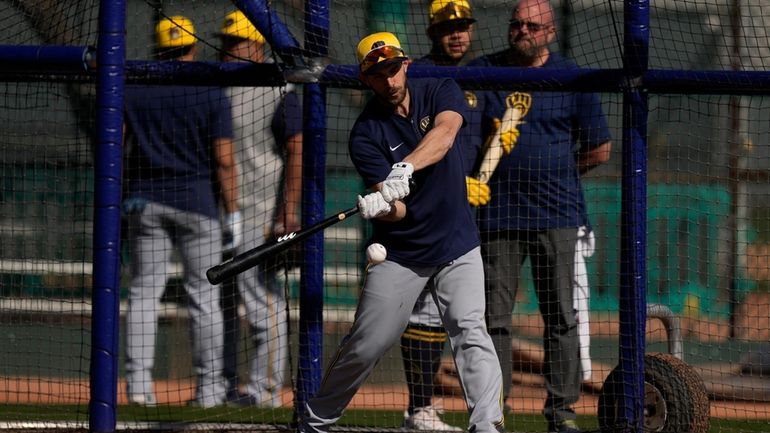 Milwaukee Brewers' Austin Nola hits during batting practice at spring...