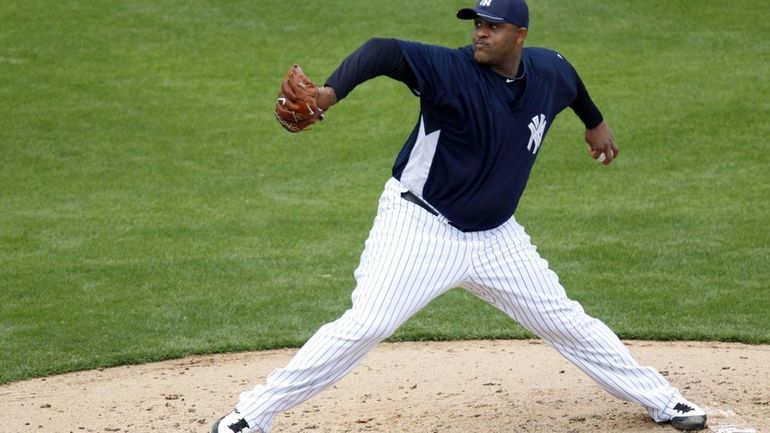 New York Yankees starting pitcher CC Sabathia throw in the...