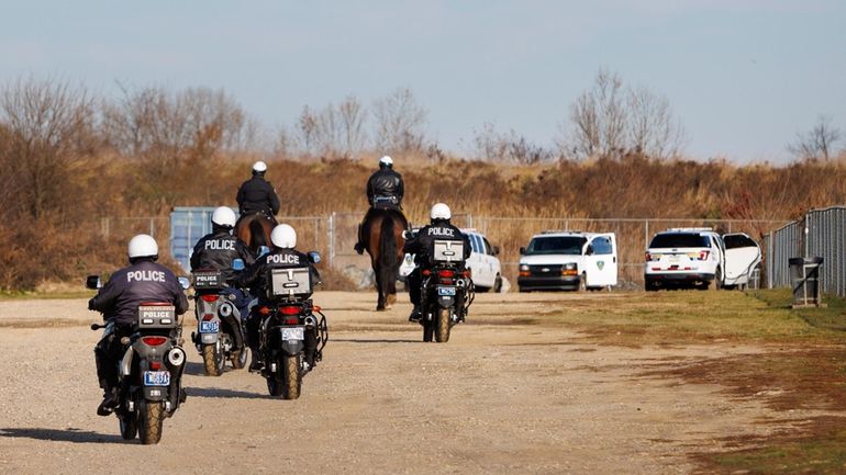 Philadelphia police mounted police and Prison guards in park behind...