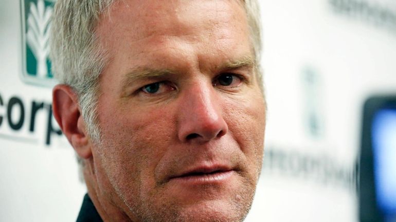 Former NFL football quarterback Brett Favre speaks with reporters prior...