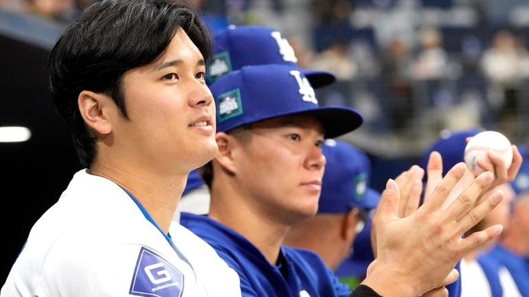 Shohei Ohtani , left, and Yoshinobu Yamamoto, right, of the...