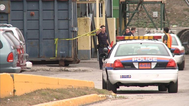 Nassau County Police investigate the scene of remains of a...