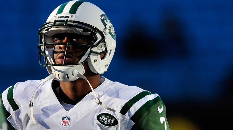 Geno Smith warms up before a game against the Carolina...