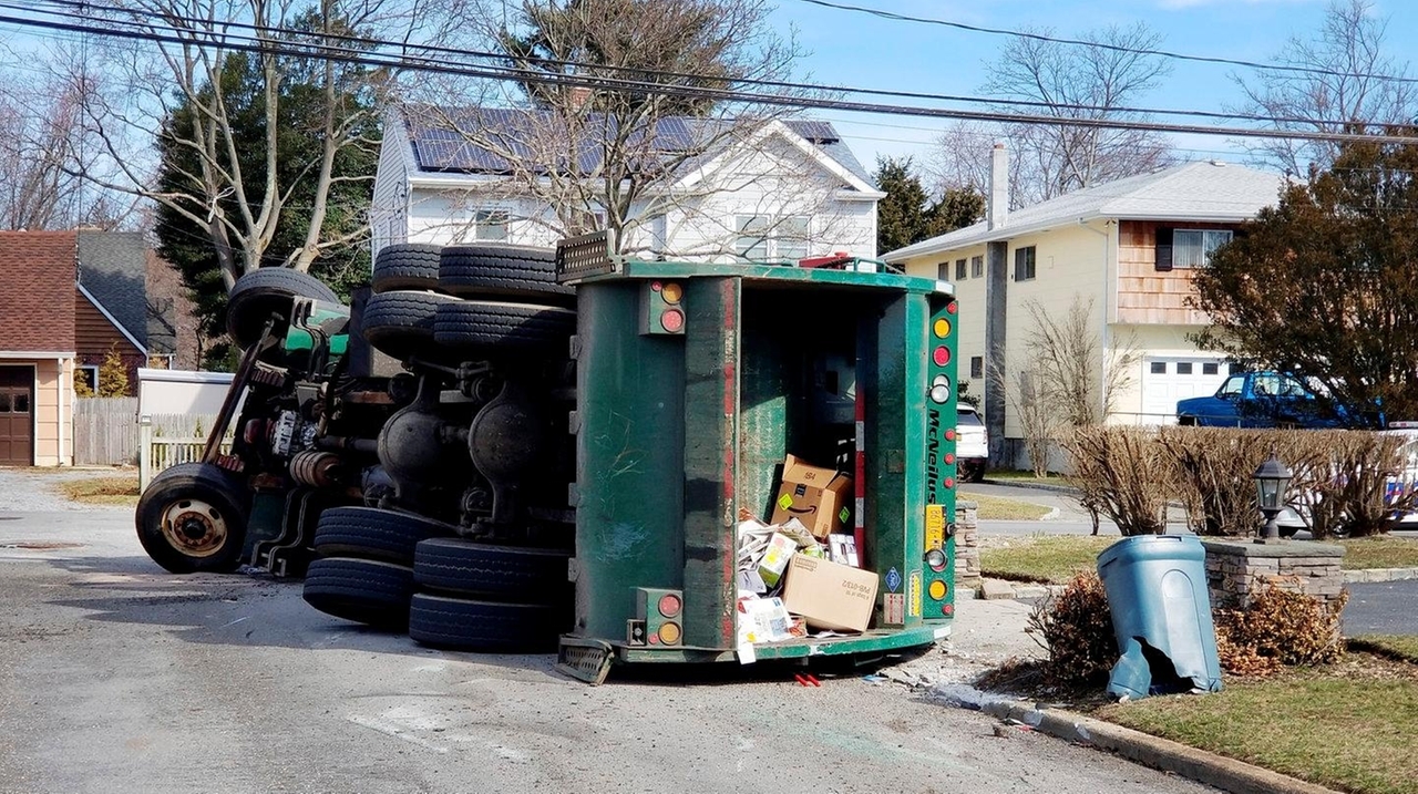 Garbage truck overturns on Islip street, Suffolk police say Newsday