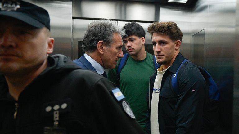 French rugby players Oscar Jegou, right, and Hugo Auradou, second...